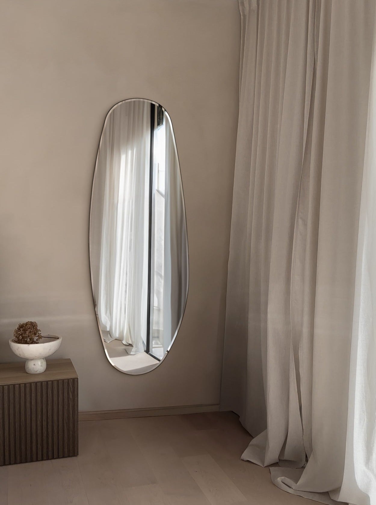 Opal Mirror Large in room next to curtains