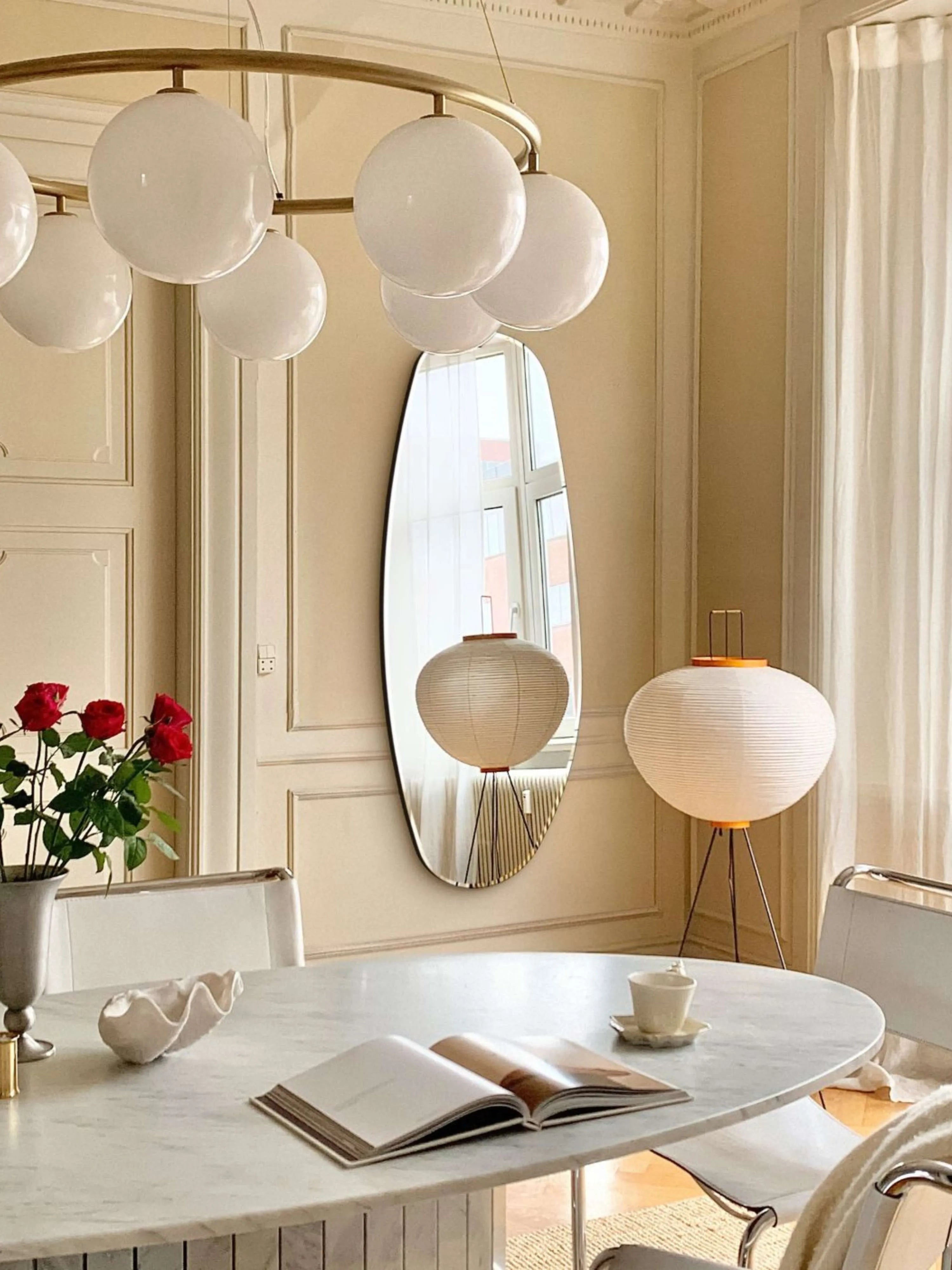 Opal Mirror Large in living room with standing pendant light and marble table