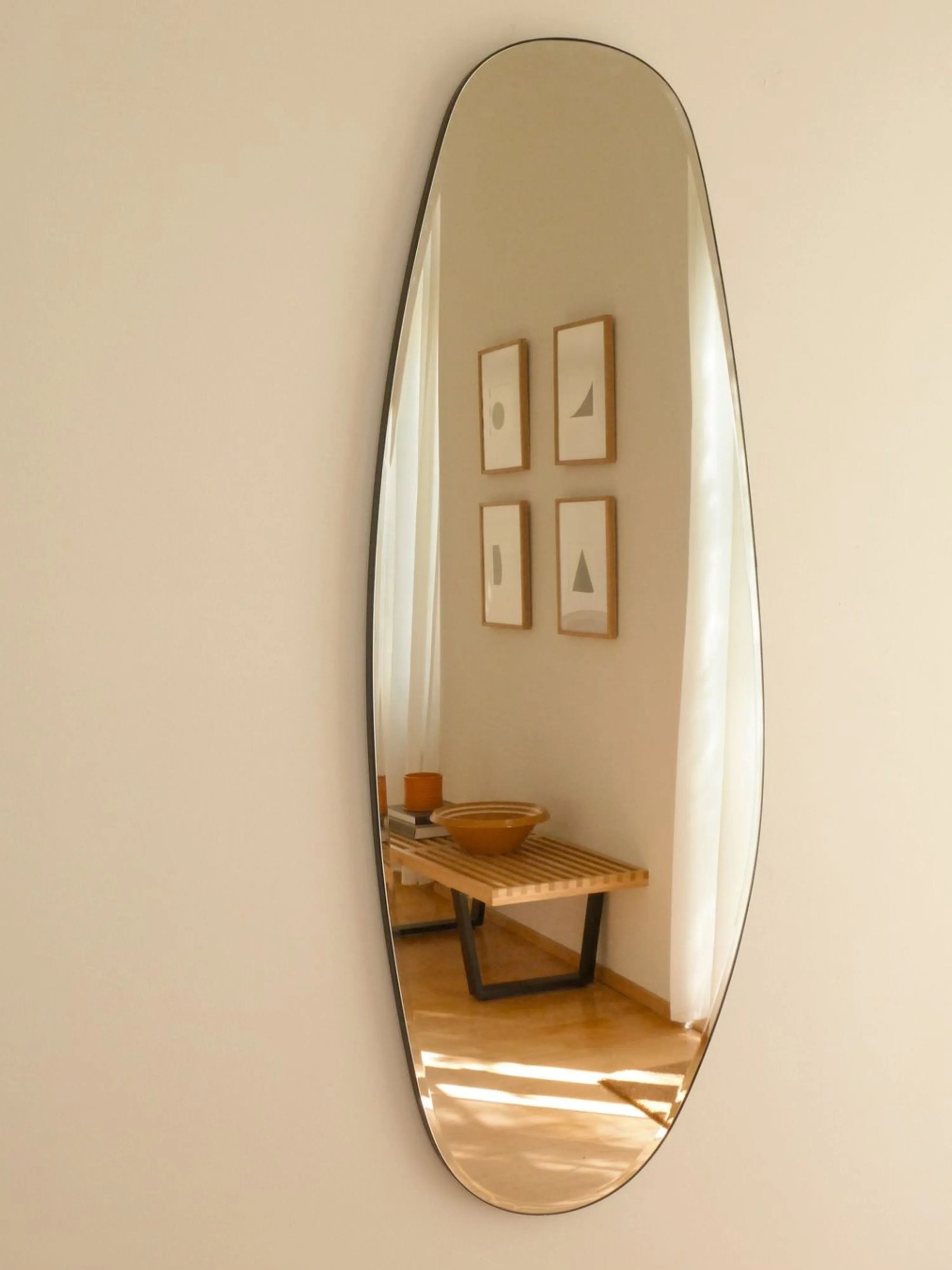 Detail of the Opal Mirror Large blending with neutral-toned home decor.