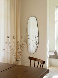 Opal Mirror Large in beautiful dining area reflecting dried flowers